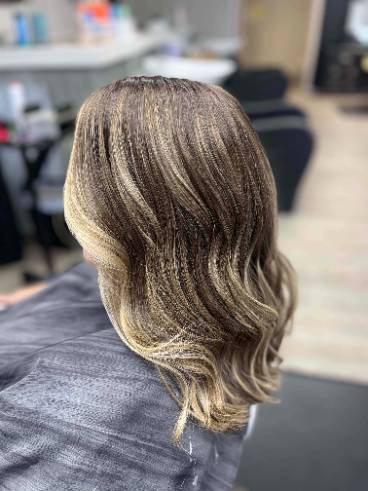 side view of layered wavy lady's hairstyle