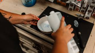 hairstylist emily alexander prepares a hair treatment serum